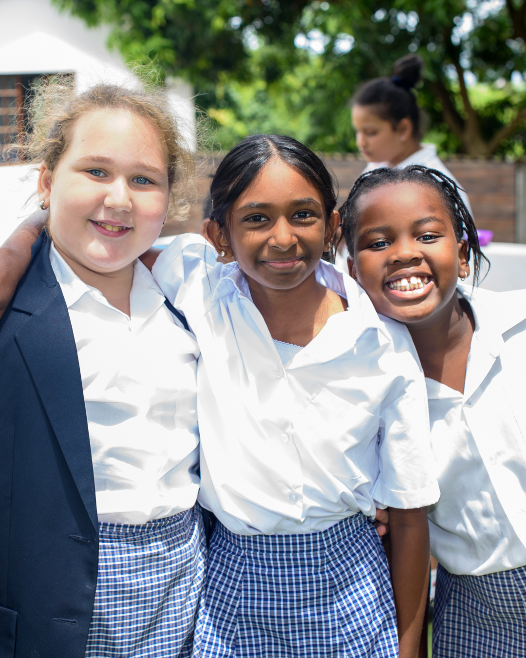 Three Hamptons pupils smiling together